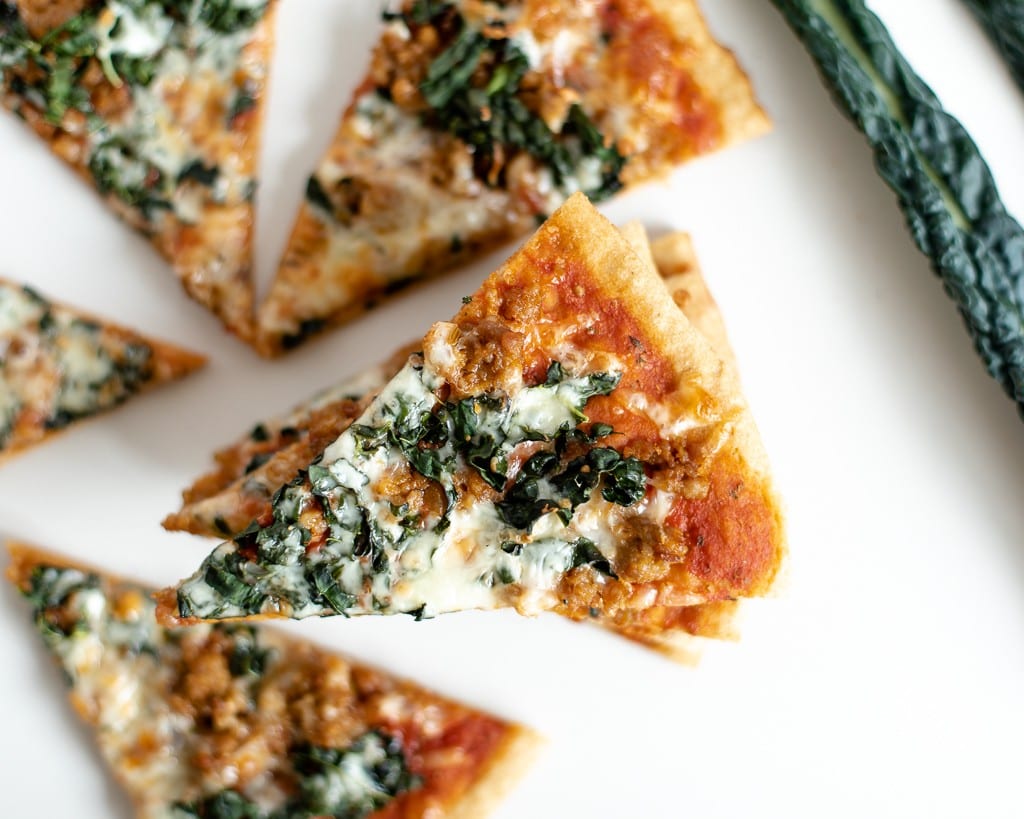 kale and sausage pizza with einkorn crust