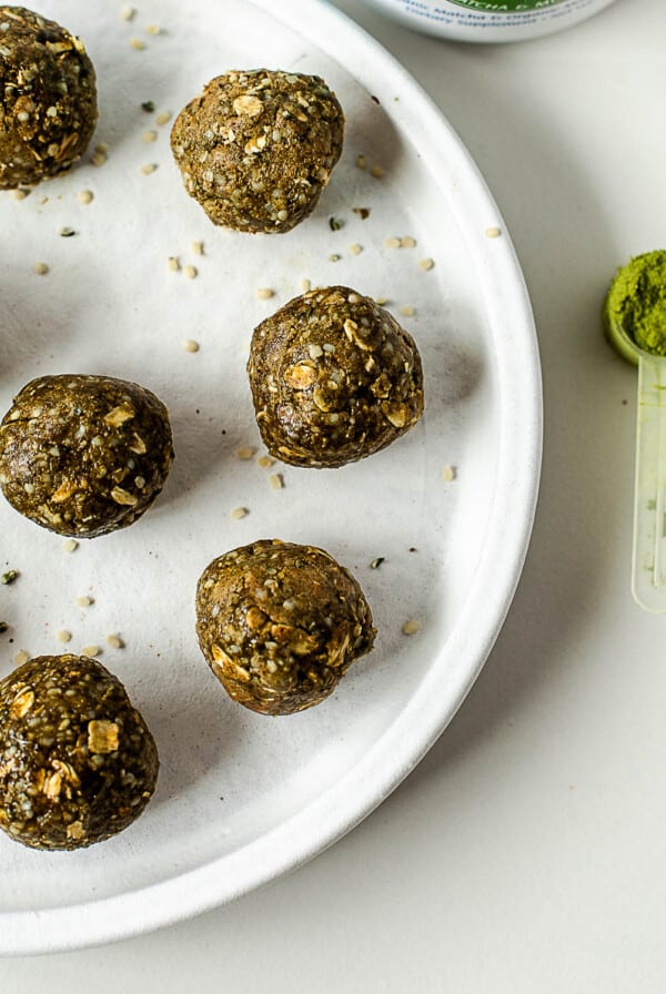 Healthy no-bake matcha protein balls made with vanilla protein powder, oats, almond butter, and matcha powder.