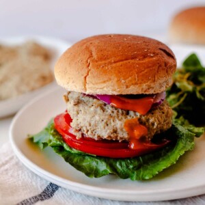 serving of IP turkey burgers with a bun on a plate
