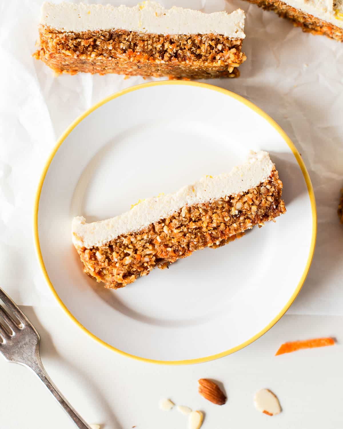 overhead shot of one of the vegan carrot cake bars on a plate