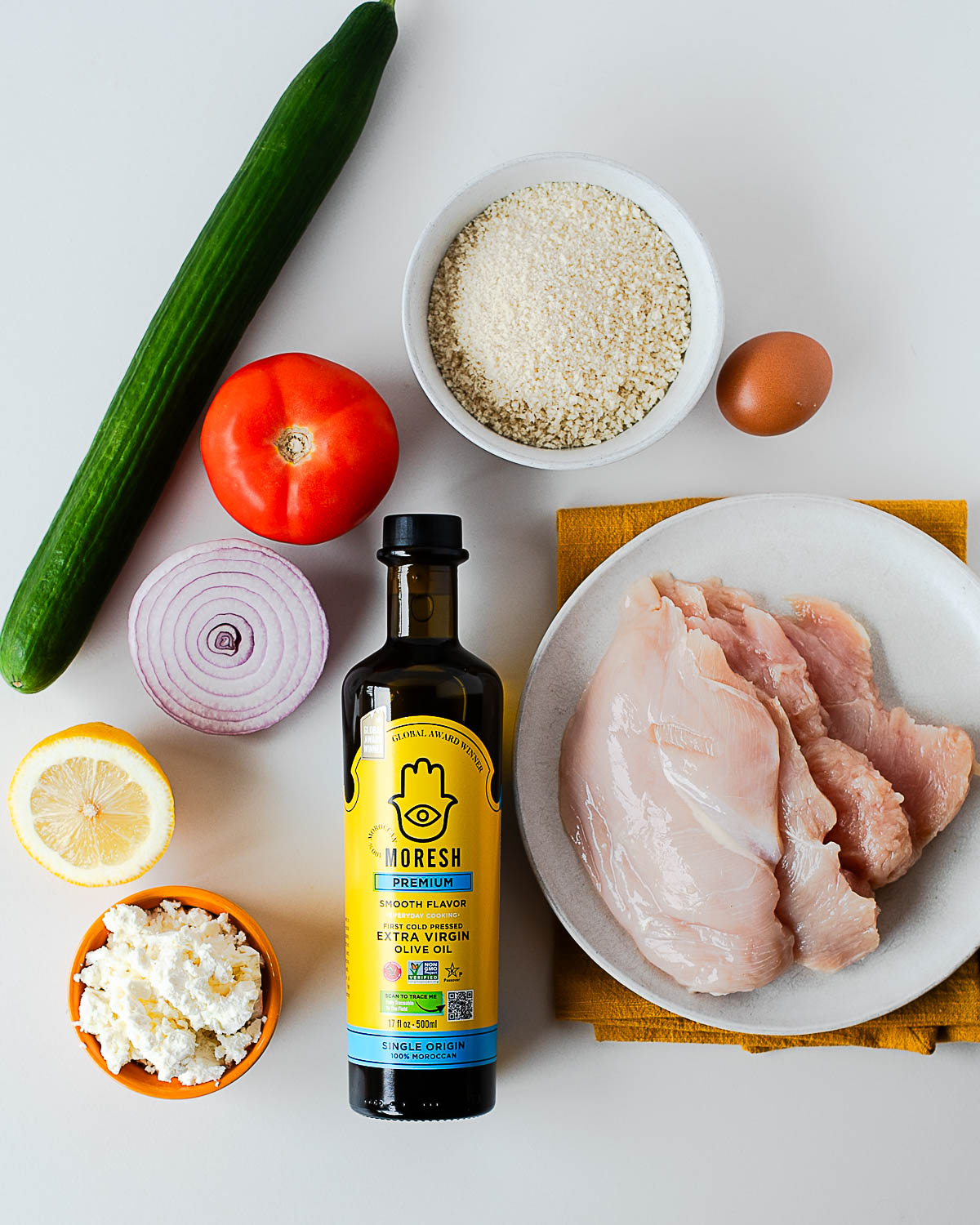 Simple ingredients you’ll need crispy chicken cutlets with a Mediterranean cucumber tomato salad
