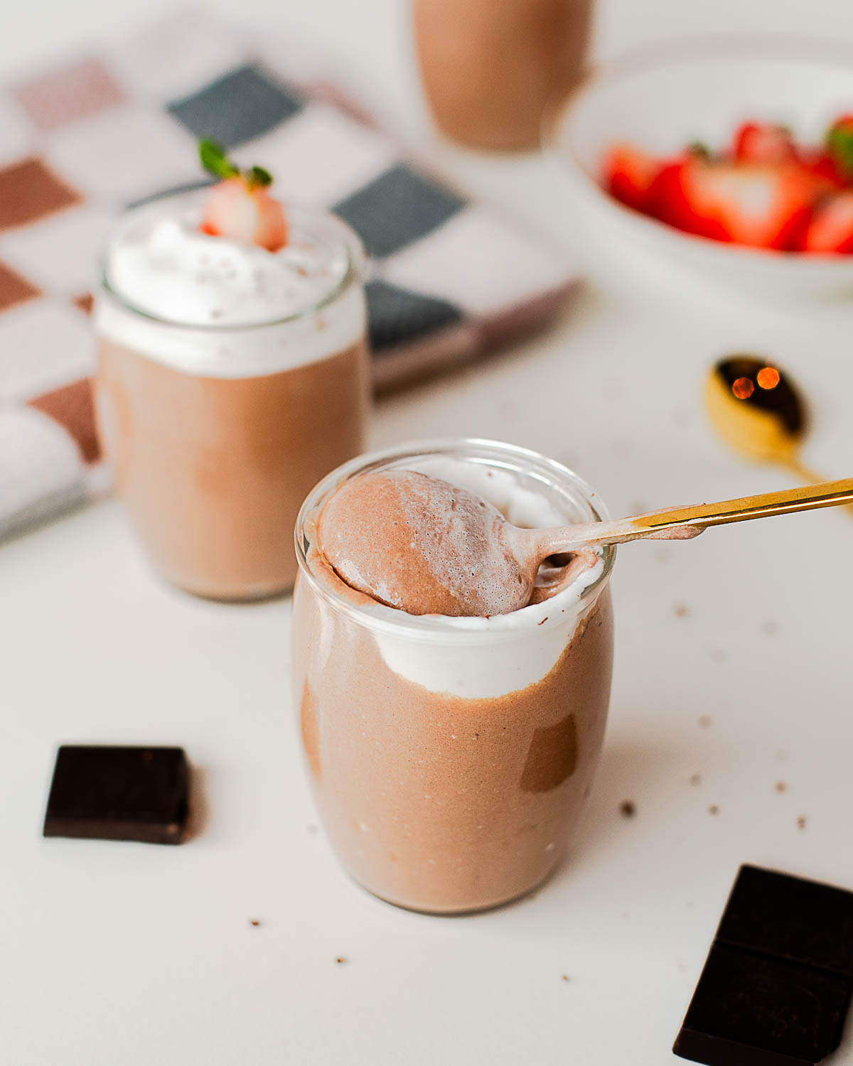 Spoonful of whipped cottage cheese chocolate pudding showing thick, mousse-like texture.