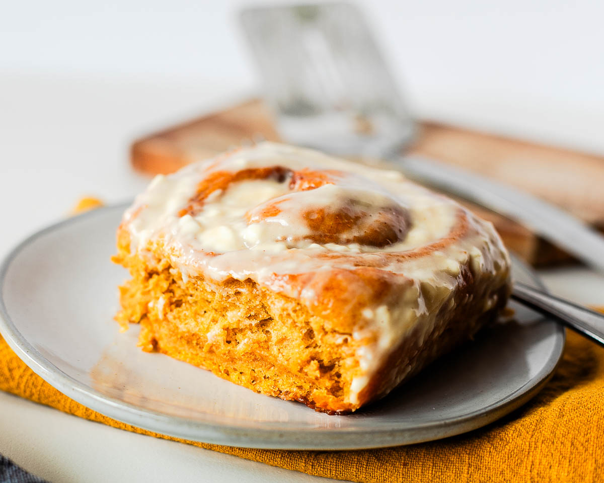 Fluffy sweet potato cinnamon roll with maple cream cheese glaze