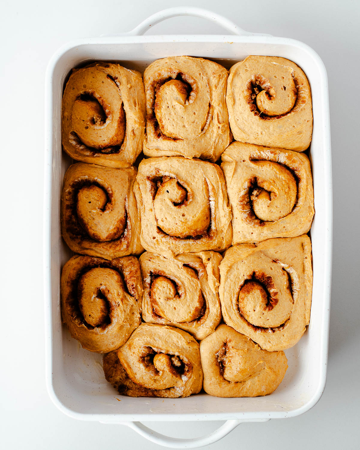 Overnight sweet potato cinnamon rolls risen and ready to bake
