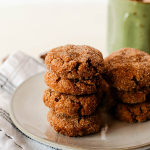 Stack of vegan sweet potato snickerdoodle cookies showing soft texture and cinnamon sugar topping
