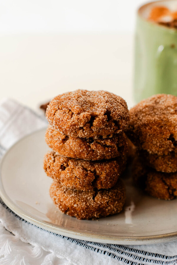 Stack of vegan sweet potato snickerdoodle cookies showing soft texture and cinnamon sugar topping