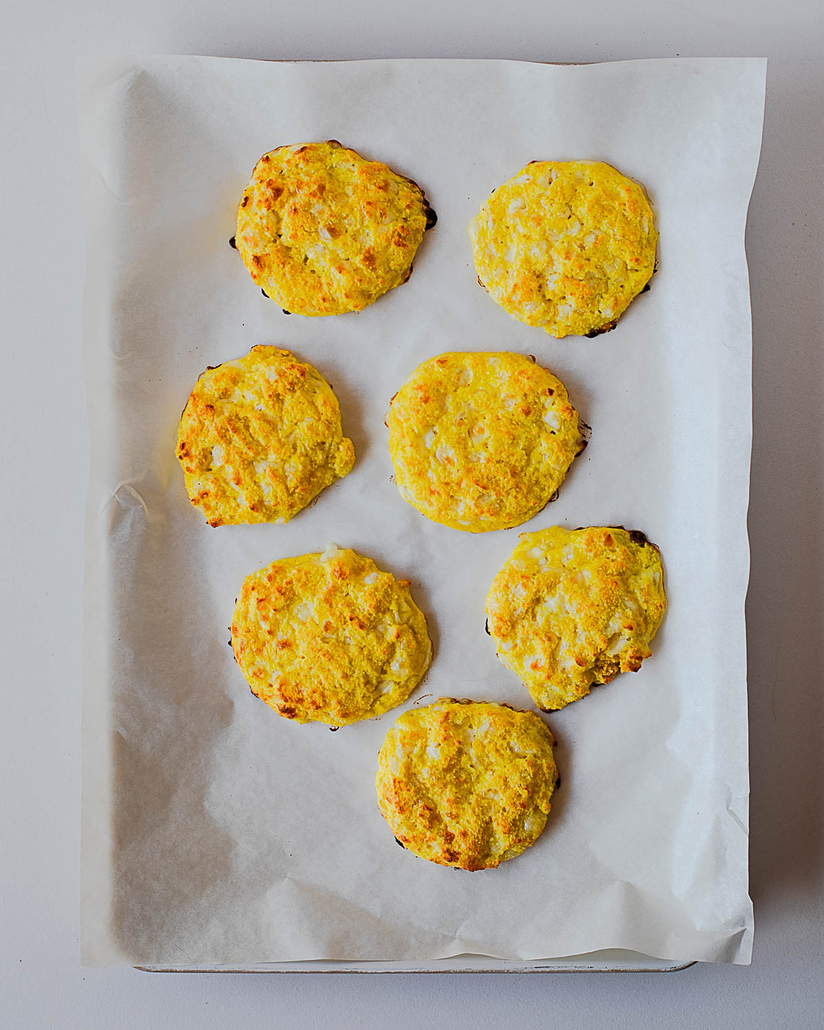 Baked cottage cheese pizza crust bites fresh from the oven, lightly golden and set