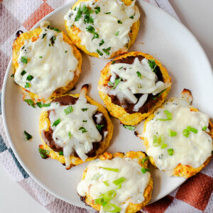 Close-up of cottage cheese pizza bites with melted cheese and pizza-style toppings