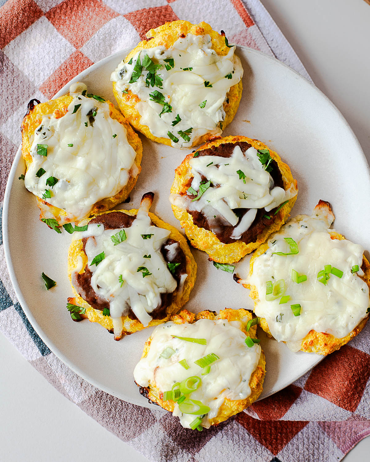 Close-up of cottage cheese pizza bites with melted cheese and pizza-style toppings
