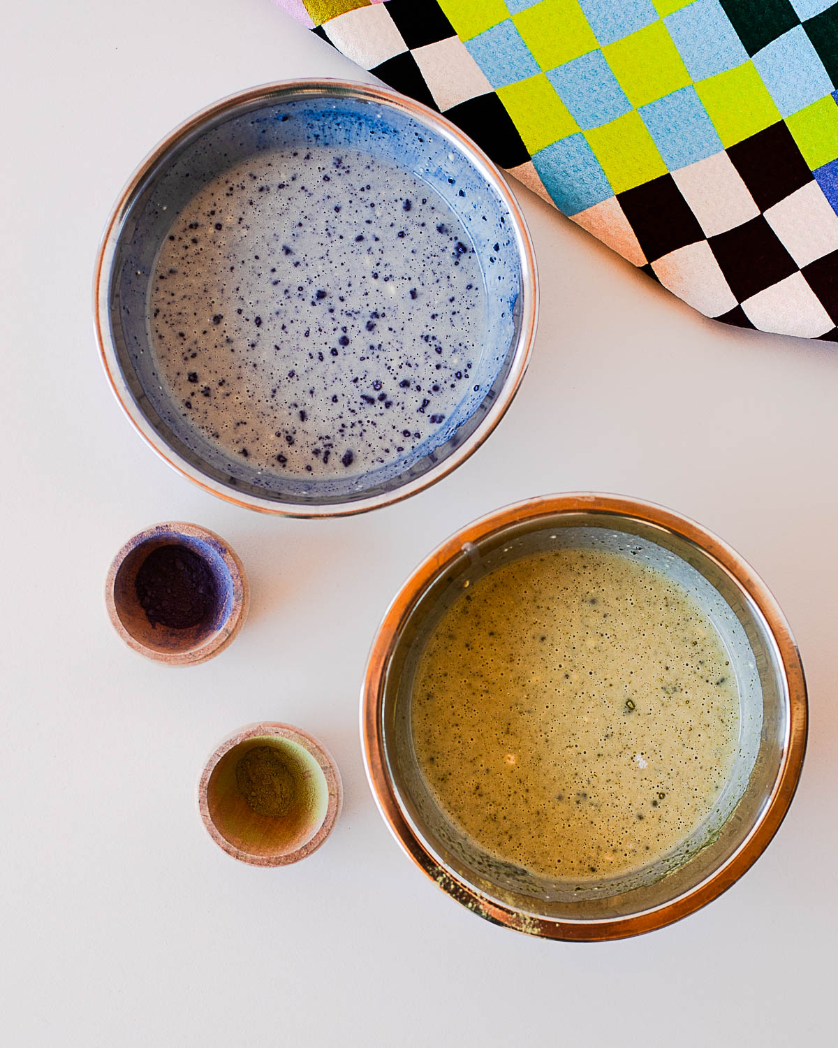 Earth Day waffles batter split into blue butterfly pea and green matcha mixtures in bowls