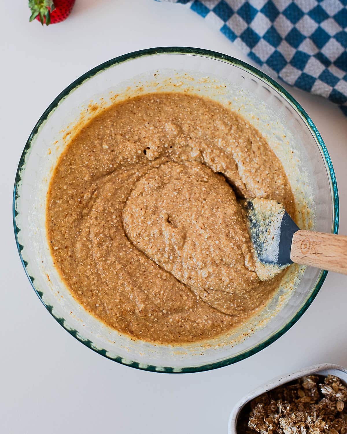 Mixed strawberry coffee cake batter in a glass bowl with a soft, thick texture