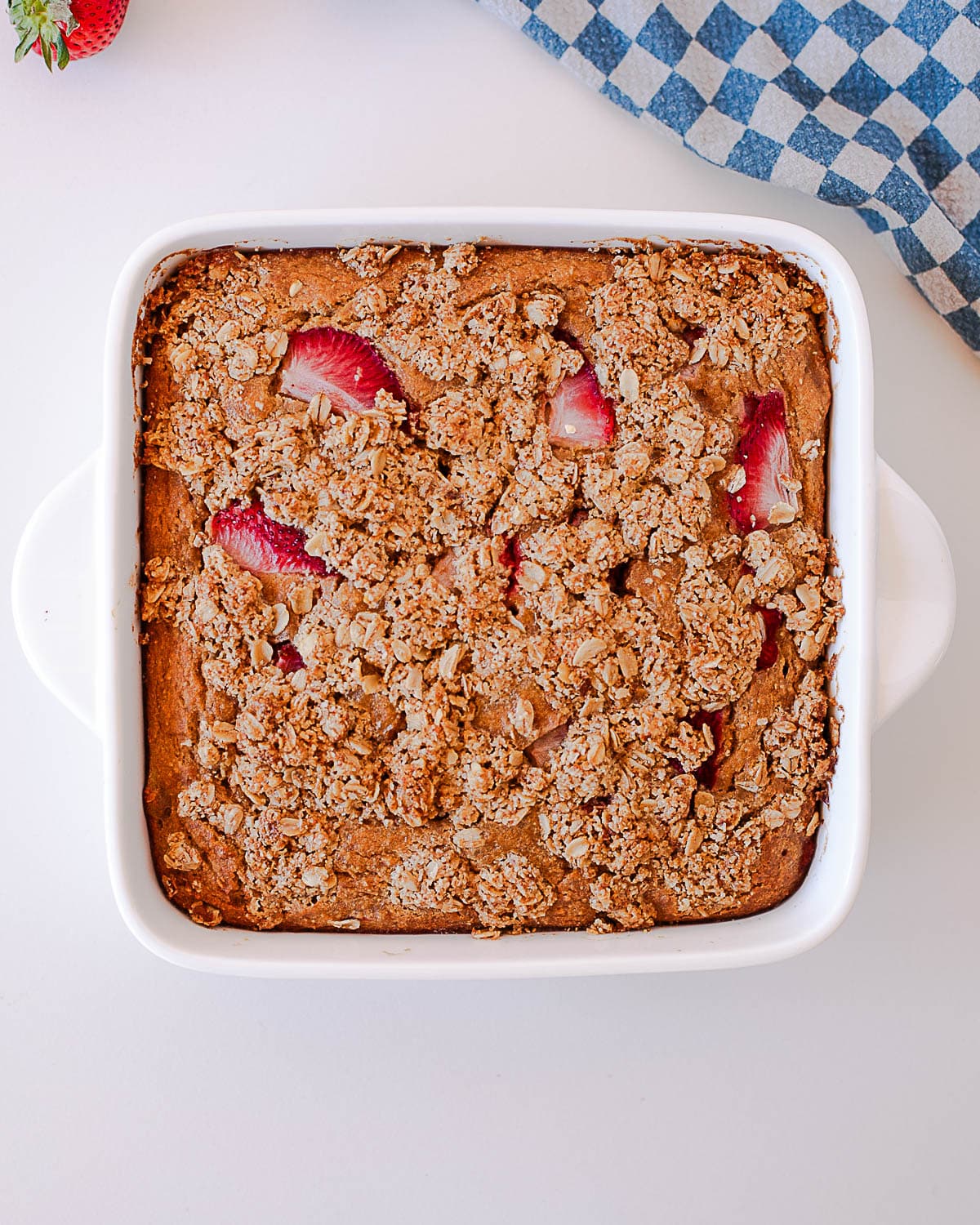 Finished strawberry crumb coffee cake with crumble topping in square baking dish
