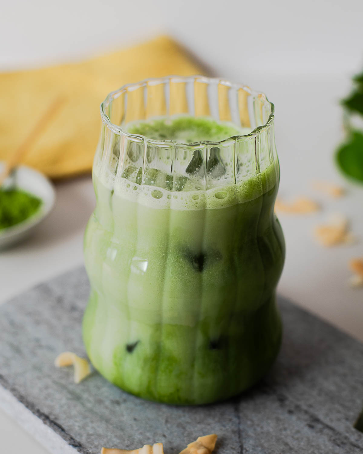 High protein iced coconut matcha latte made with ceremonial grade matcha powder, coconut milk, and vanilla protein powder.