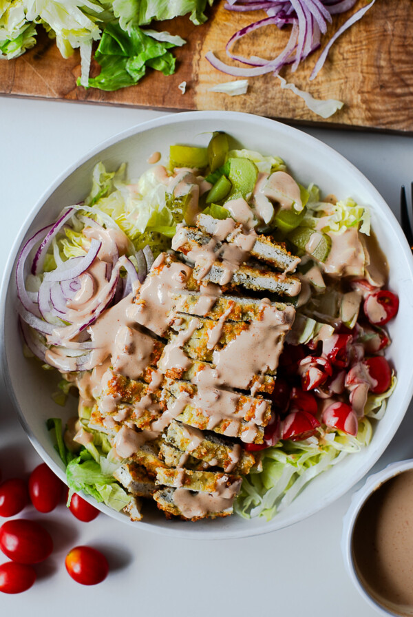 Overhead shot of chicken cutlet bowl drizzled with homemade burger sauce