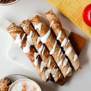 Close-up of apple crepe roll ups drizzled with cottage cheese honey dip