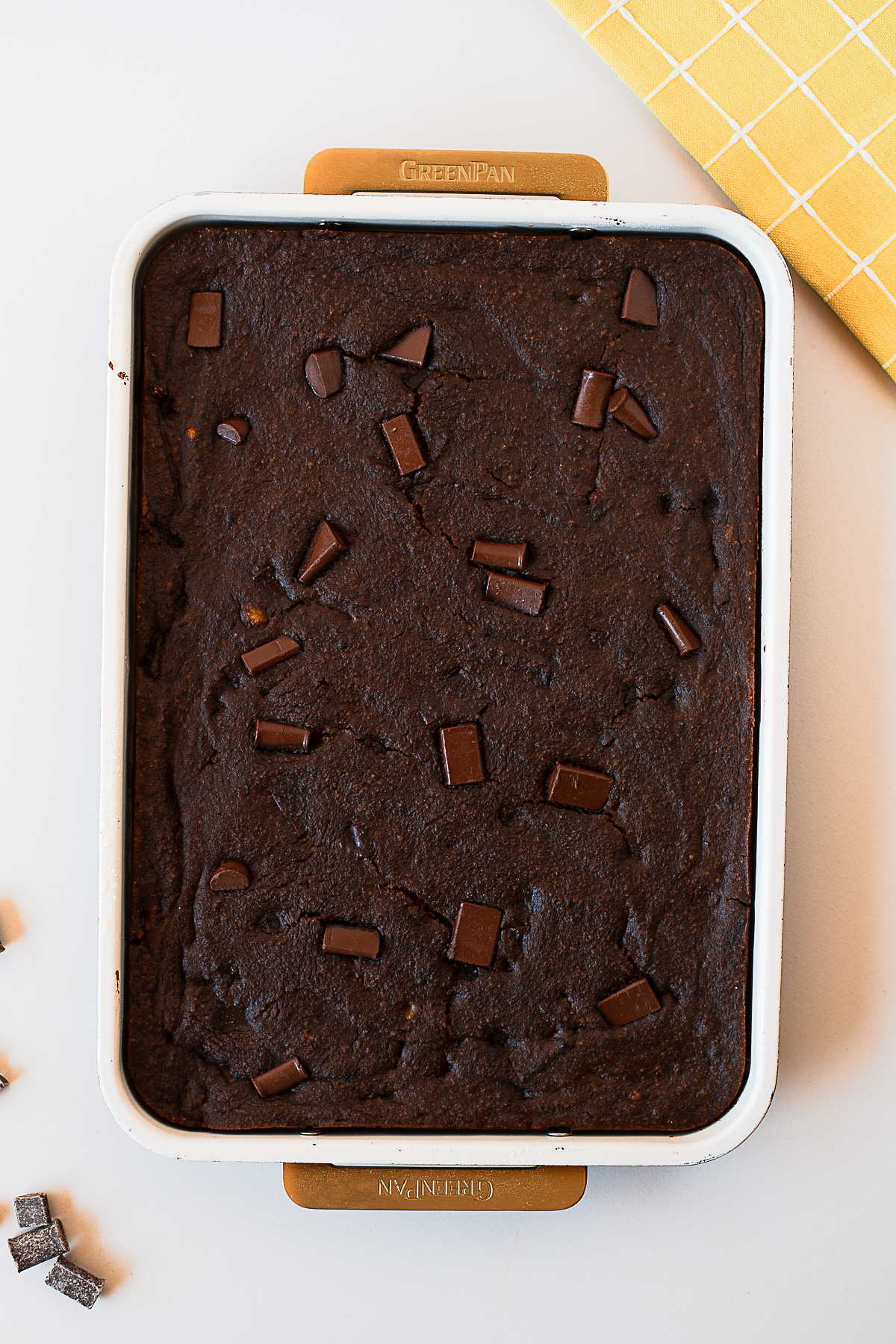 Baked gluten-free chocolate spoon cake in a white sheet pan