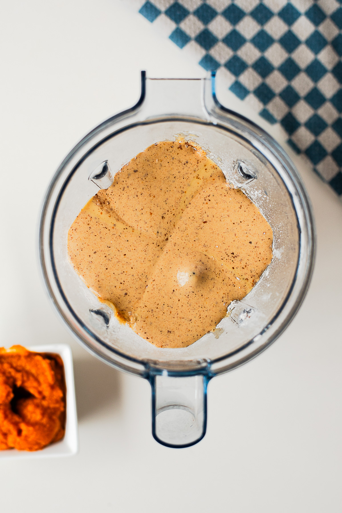Pumpkin protein waffle batter blended smooth in a blender